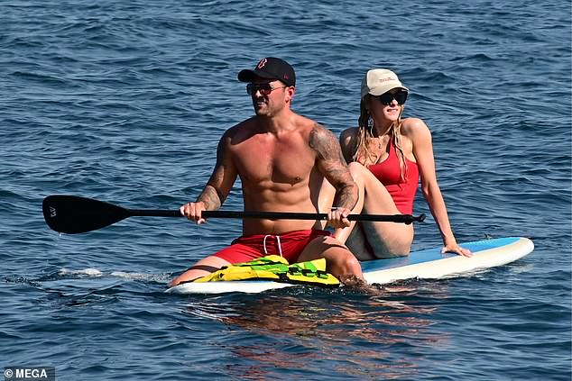 The lovebirds enjoyed some paddling time while getting a tan.