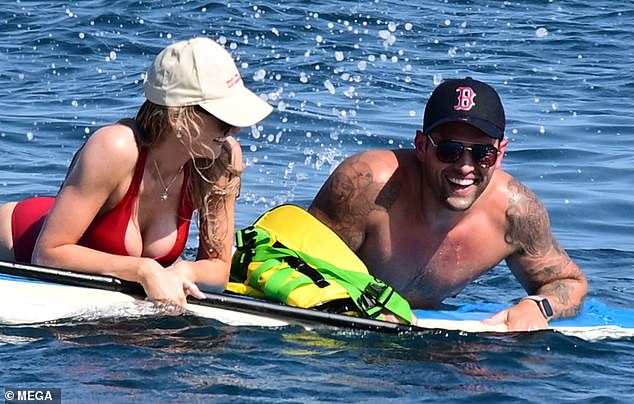 The couple chatted intensely while in the water.