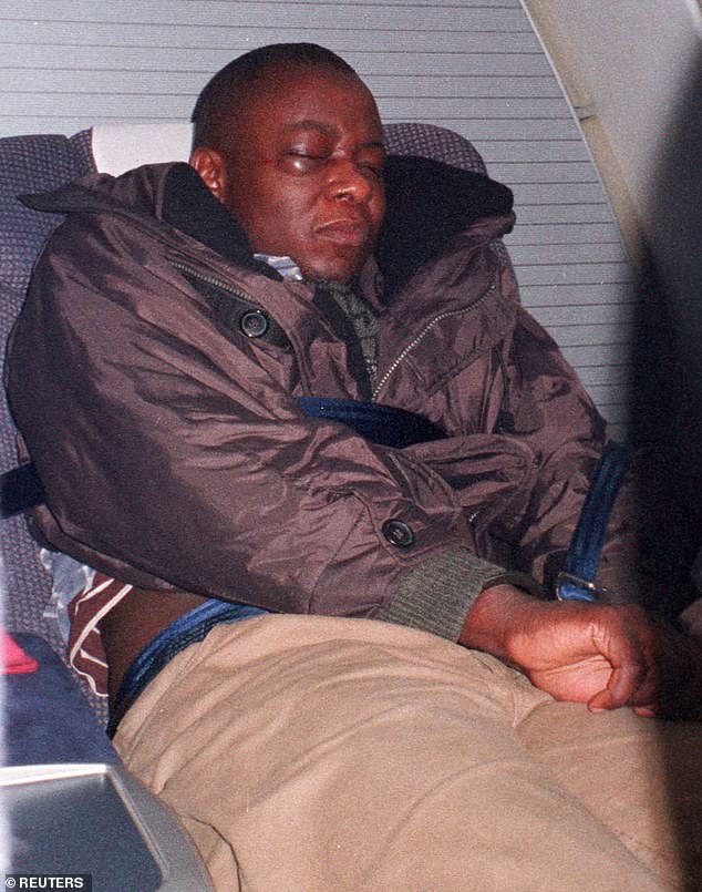 The hijacker of a British Airways jumbo jet bound for Kenya, Paul Kefa Mukonyi, 27, sits with his hands tied on the plane.