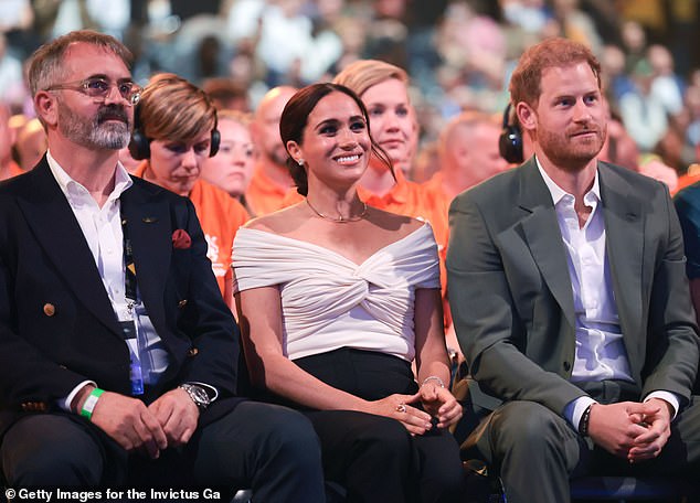 Invictus Games Foundation CEO Dominic Reid (left), Harry and Meghan, Duchess of Sussex (centre), at the opening ceremony of the Invictus Games The Hague 2020