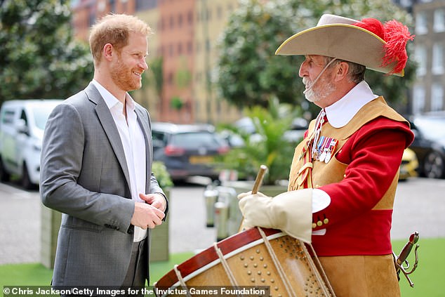 Prince Harry speaks today with a member of the Company of Pikemen and Musketeers at the Honourable Artillery Company in London