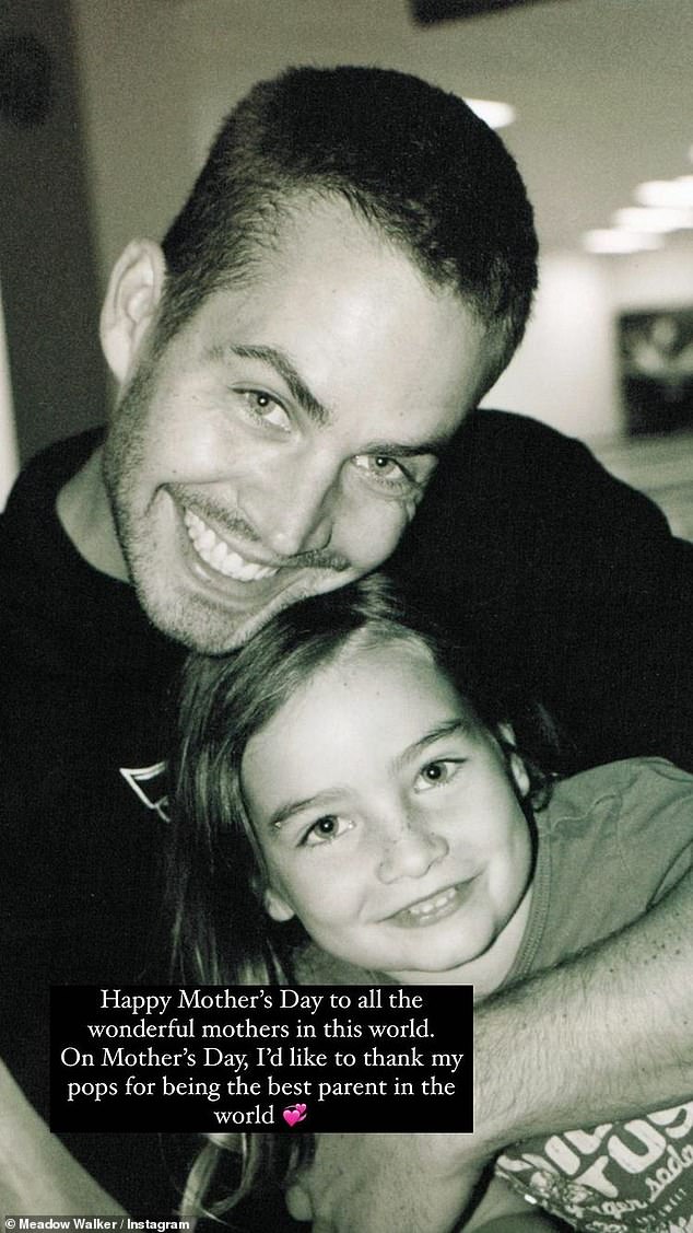 The star is pictured with her late father in 2013.