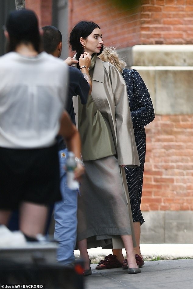 She was dressed in a sheer grey maxi skirt for the photo shoot in Manhattan.