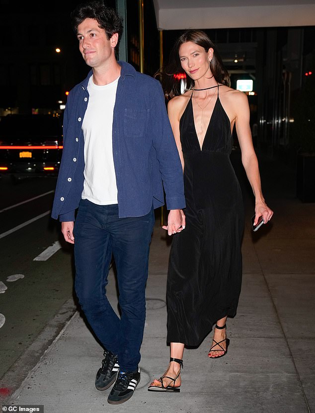 Karlie Kloss mirrored Huma's chic aesthetic as she rocked a plunging black dress while holding hands with husband Joshua Kushner.