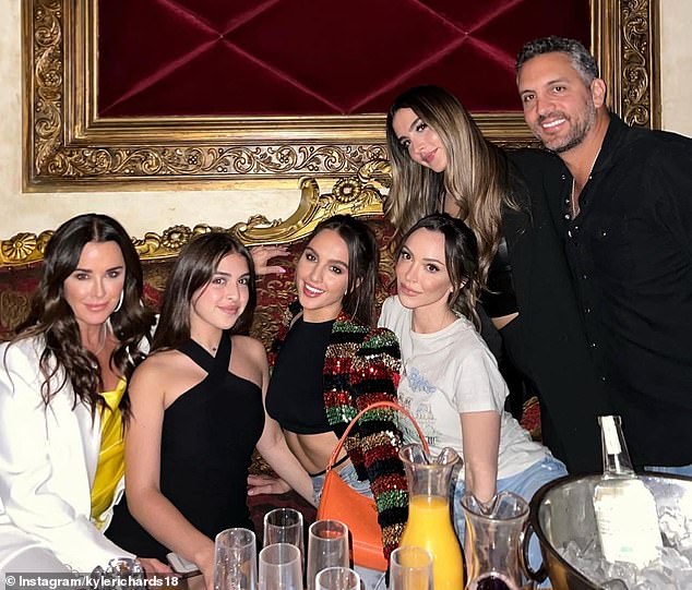 Kyle and Mauricio were pictured with their three daughters Alexia, 27, Sophia, 24, and Portia, 16, as well as Kyle's oldest daughter Farrah, 35.