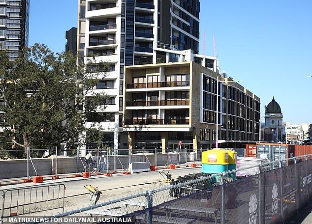 Apartment builders in particular are struggling as Australians prefer to live in houses, while developers are battling eroding margins (pictured, a construction site in Parramatta, Sydney).