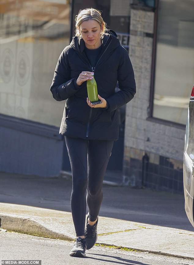 The shoe designer stepped out for a green juice on a cold Sydney day.