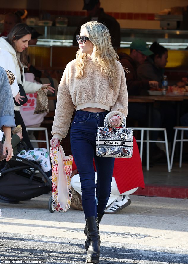 Radio giant Kyle Sandilands' wife arrived at Bondi Junction. Tegan stopped at Chargrill Charlies where she bought some chicken for dinner and took it home to her family.