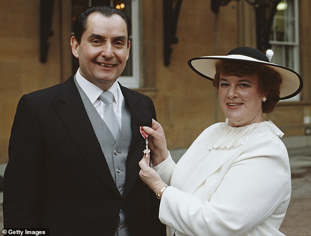 Pictured: Ray and Sue Reardon pose with their OBE outside Buckingham Palace in 1985, the same year the snooker star left his wife for Carol Covington.