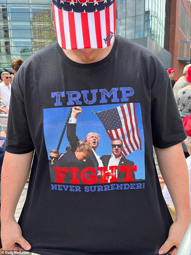 Rally attendees wore T-shirts depicting Trump raising his fist after rising again following the shooting in Butler, Pennsylvania.