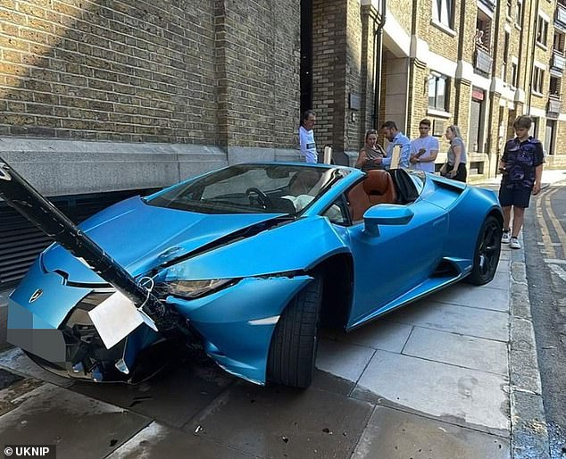 The car, which MailOnline has identified as a Huracan EVO Spyder with a price tag of more than £218,000, crashed into a pole marking a cycle route on Wapping High Street on Friday, just metres from a London Overground station.