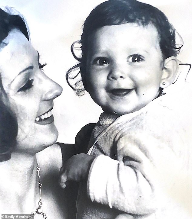 Emily is pictured here at nine months old with her mother; she began moving in and out of foster care from the age of five.