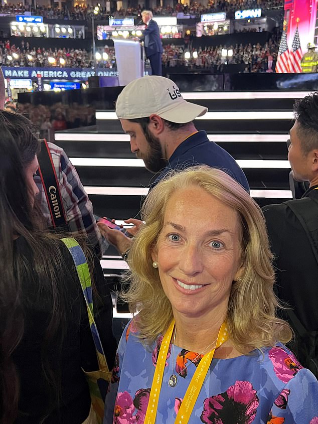 Ms. Graham posing at the side of the stage as Donald Trump gave his speech at the convention.