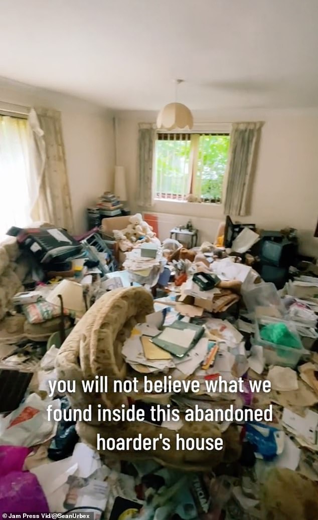 The living room floor was completely covered in what appeared to be piles of trash.