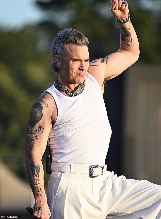 In the second half of the set, Robbie (seen) threw t-shirts into the crowd in recognition of their dance moves to Candy before singing Supreme and Millennium.