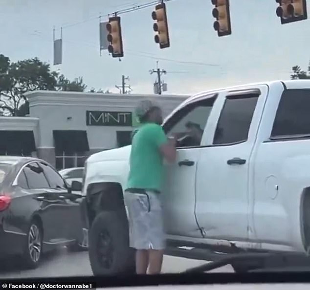 In a newly released video, Dasaur is seen arguing and attempting to hit the unidentified driver while holding what appears to be a gun in his hand on July 16.