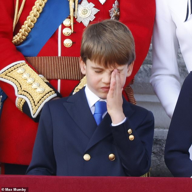 Prince Louis wipes his eye as he stands on the balcony of Buckingham Palace during the Trooping the Colour parade in June.