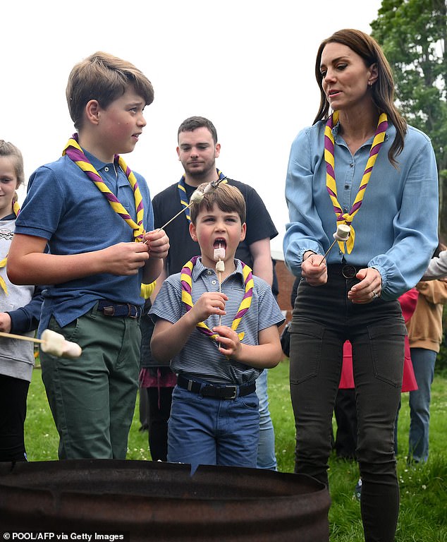 George, Louis and Kate, dressed in matching casual outfits, enjoy toasting marshmallows over the fire in Big Help Out.