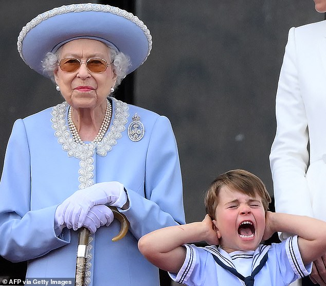 Prince George was seen covering his ears alongside Queen Elizabeth on the balcony of Buckingham Palace during the flight marking her Platinum Jubilee, June 2, 2022