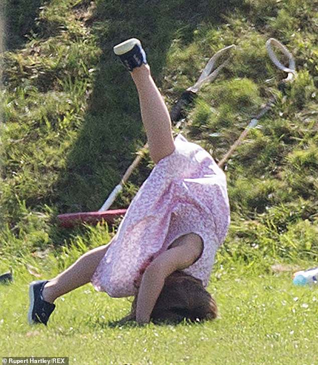 The young princess tries to do a handstand during the day.