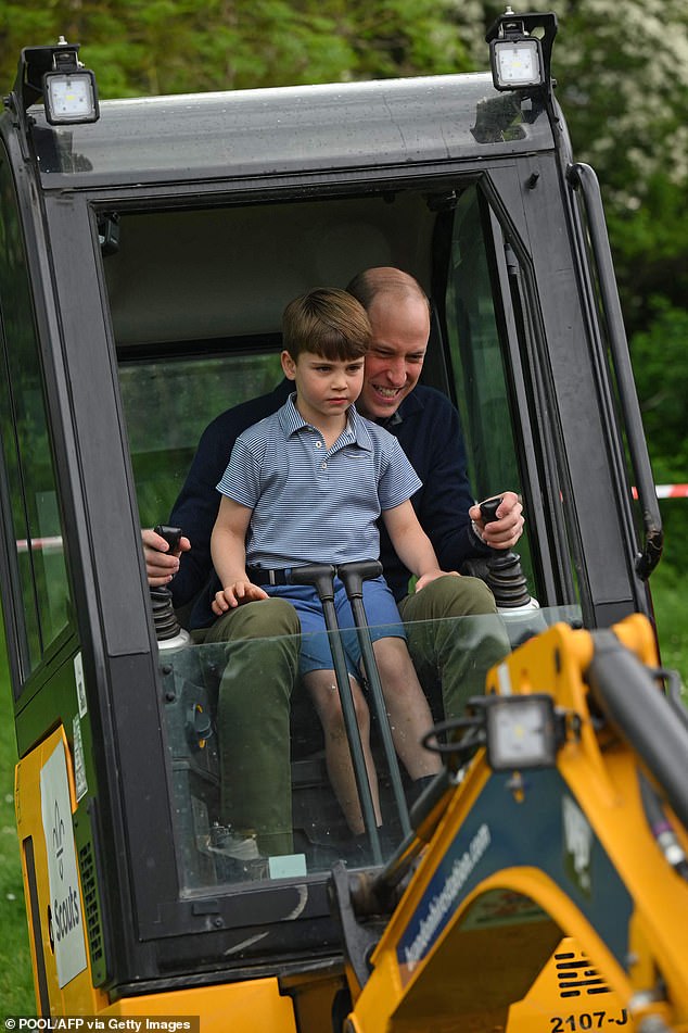 Prince William gets help from his youngest son Louis as he uses a digger during his participation in Big Help Out last year.