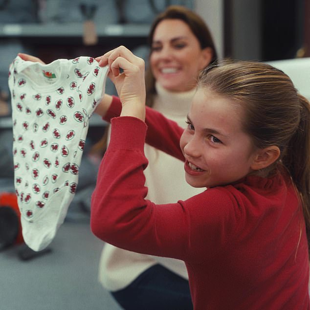 Charlotte has fun as she joins her mum at the local baby bank in 2023. The duo were packing gift bags as part of the Christmas sleepover drive, along with clothes and toys for local families.