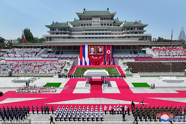 Pictured: Russian President Vladimir Putin and North Korean leader Kim Jong Un attend an official welcoming ceremony at Kim Il Sung Square in Pyongyang.