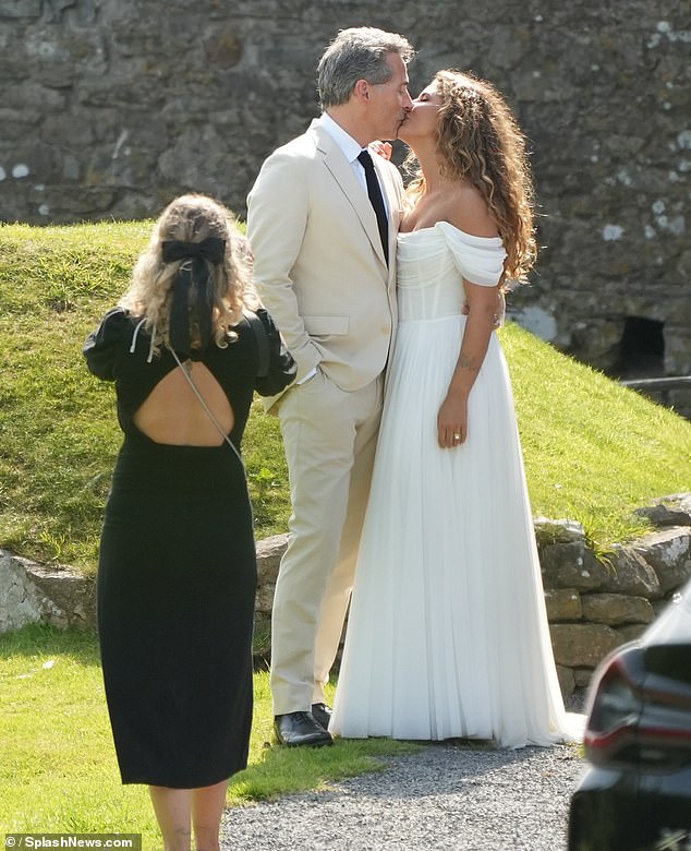 Vivian wore a gorgeous white dress for the ceremony in Wales, while Rufus, who plays Prince Andrew in Netflix show The Scoop, opted for a cream suit paired with black shoes and tie.