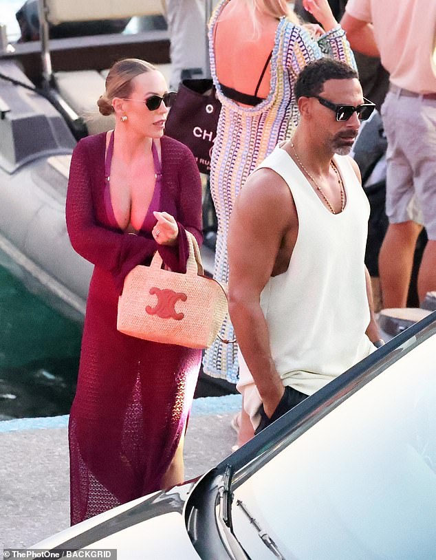 Kate looked effortlessly chic in a bikini with a matching deep purple dress, paired with her signature Hermes beach bag.