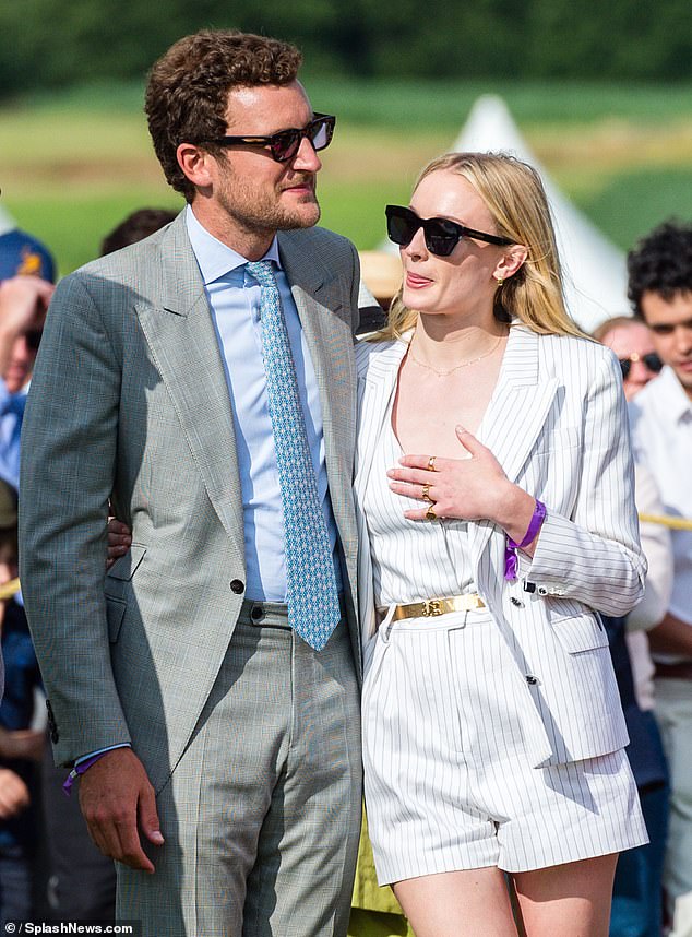 For her outing, Sophie opted for a white pinstripe suit consisting of a blazer and shorts, allowing her to show off her long legs in the sunshine.