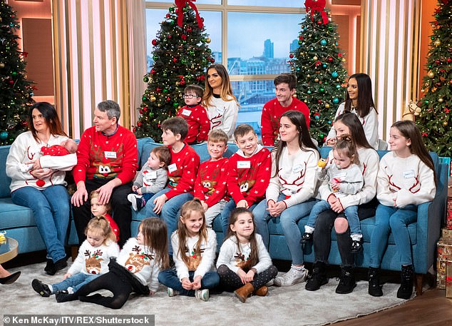 Sue and Noel Radford are pictured with their children at Christmas on This Morning in 2018