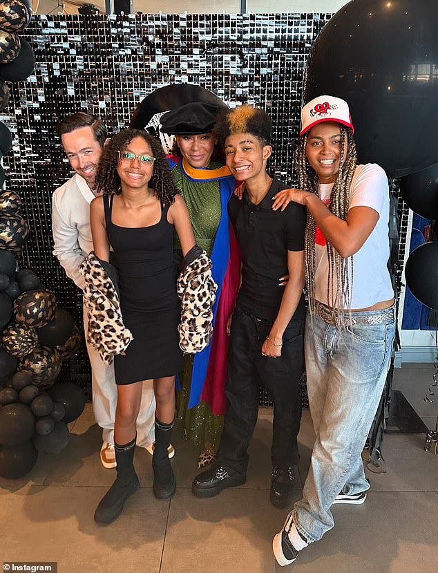 Mel B shared a rare snap with her three children Phoenix (right), Angel (center-right) and Madison (center-left) on Wednesday as she celebrated receiving an honorary doctorate for her work with victims of domestic abuse.