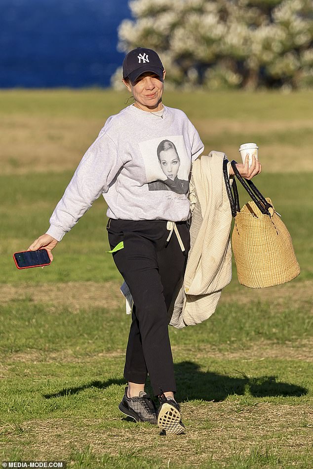 The former Home and Away star, 45, was all smiles as she took her dog for a sunny stroll in Coogee.