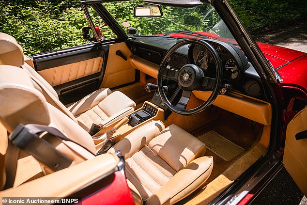 Inside the sports car which is in perfect condition.