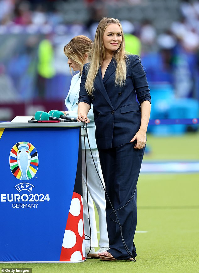 While presenting the Euros from Germany, she swapped her usual fitted, elegant dresses for double-breasted suits and blazers (pictured at the final).