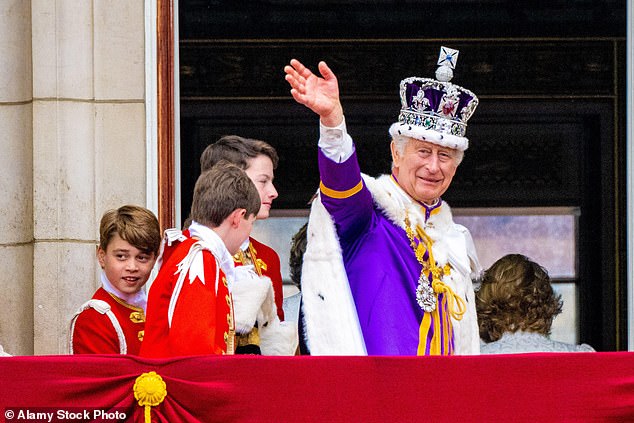 George turns to look at the crowd on the balcony of Buckingham Palace on the day of his grandfather King Charles' coronation, May 6, 2023.