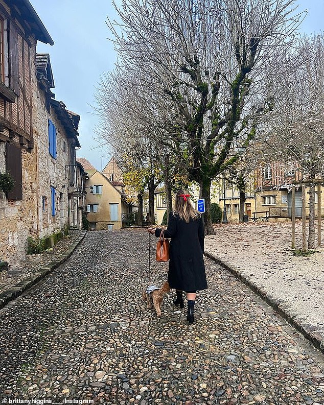 Brittany Higgins is pictured with her cavoodle, Kingston, just after moving to France in December.