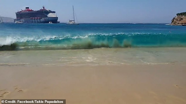 A huge cruise ship can be seen in the background of the video, but beachgoers blamed the passenger ferry's excessive speed.