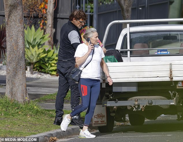 Vince appeared to be in good health, wearing a loose shirt under a vest.