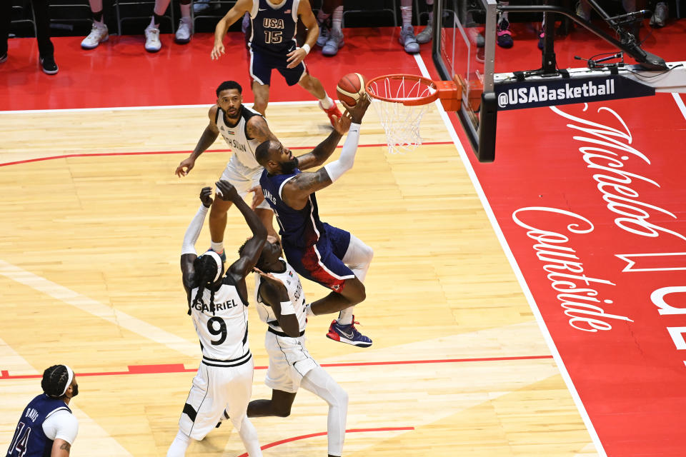 LeBron breaks through the defense and makes the game-winning layup. (Mansoor Ahmed/NBAE via Getty Images)