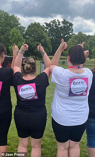 Danielle and her friends give a standing ovation at the race