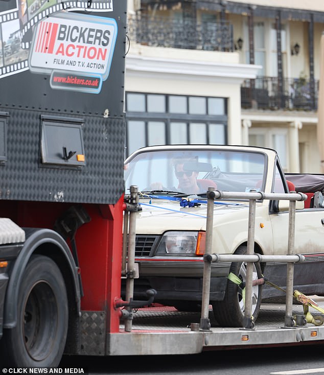 Matt was seen driving a car around the coastal town as part of filming.