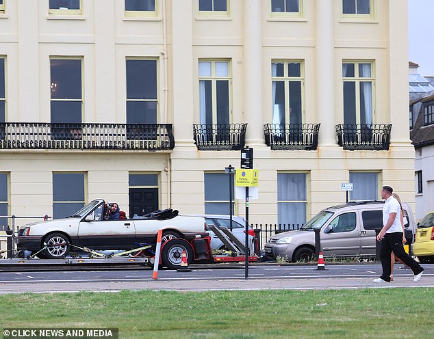 Kieran is seen being filmed walking alongside the car driven by Matt, but the star is not on set at the time.