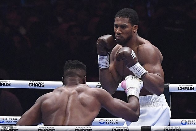 Joshua pictured during his fight with MMA fighter Francis Ngannou in March.