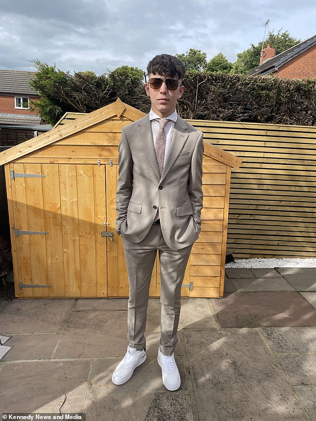 The witty school leaver emerged from the body bag dressed in a smart £600 suit.