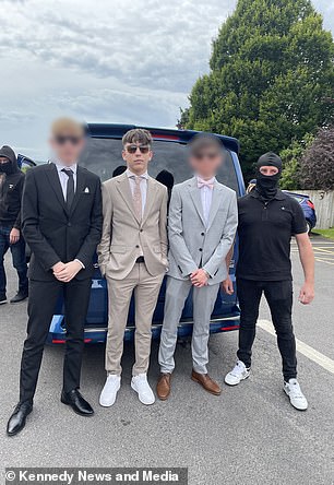 Lucas is photographed with his friends before entering the prom.