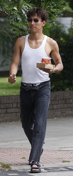 He left the top button of his jeans open and carried some lunch.