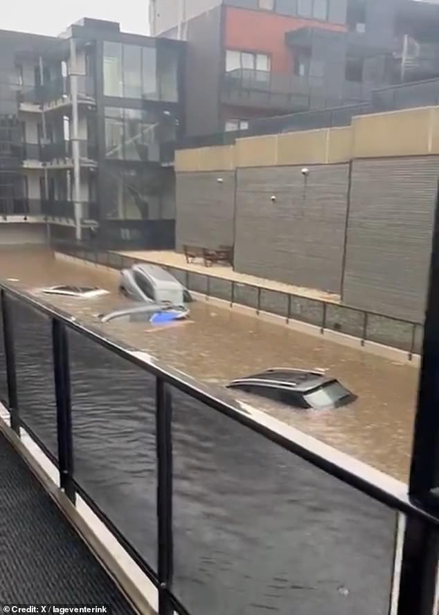 NETHERLANDS: Floodwaters have caused flooding of vehicles and trapped people in their homes in the city of Enschede