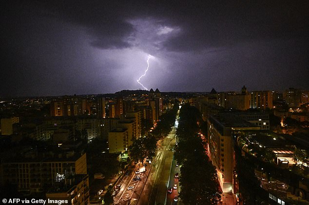 FRANCE: Lightning is seen over a district of Paris amid thunderstorms in France ahead of the start of the Olympic Games in the French capital.