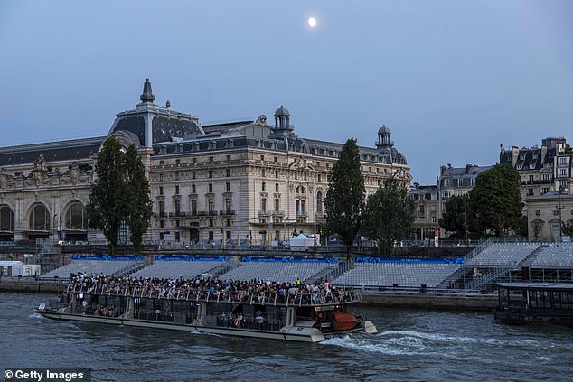 Empty seats prepared for the opening ceremony are seen along the Seine River on July 17, 2024 in Paris.